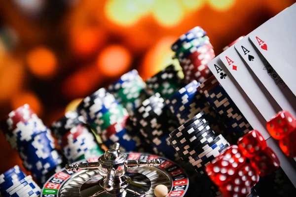 Roulette table with dealer spinning wheel and chips visible on board